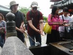 Jimbo & Hugh wash in the holy water