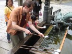 Richard applies healing waters to the purple eye