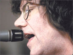 Peter Detmold, lead singer and guitar player for The Reducers, rehearses at the group's studio above Roz' Deli in New London.